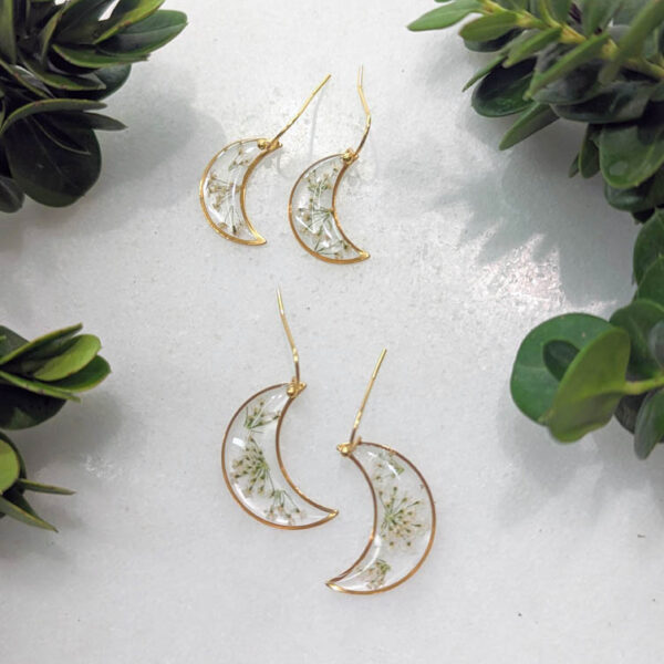 dainty gold moon earrings, transparent with real white wildflowers inside